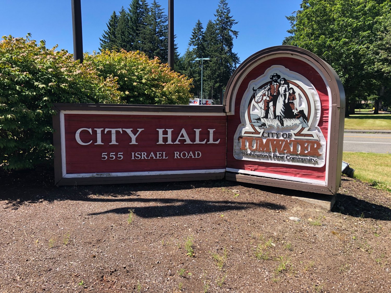 The sign in front of Tumwater City Hall shows the city's logo.